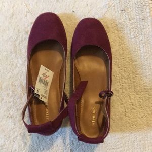 Plumb colored fabric heels.